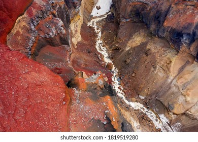 Aerial top view on colorful Dangerous Canyon (Opasniy Canyon) near the Mutnovsky volcano on the Kamchatka Peninsula, Russia - Powered by Shutterstock