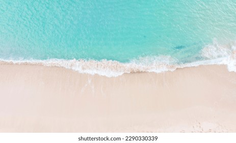 Aerial top view on nature landscape view of beautiful tropical clean sandy beach and soft blue ocean. Aerial top-down drone view. - Shutterstock ID 2290330339