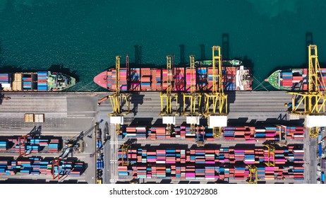 Aerial top view over international cargo ship at industrial import-export port prepare to load containers with big container loader ship vessel. global transportation and logistic business.