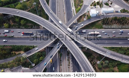 Aerial top view photo of highway multilevel junction road in urban populated area