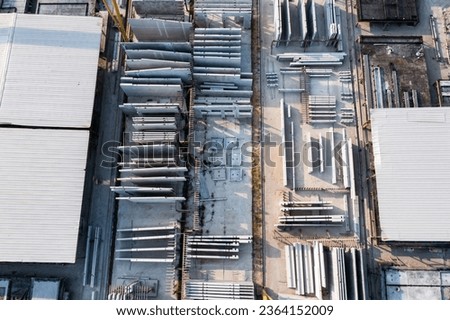 Aerial top view of Precast concrete wall panel for construction building site in warehouse factory. Precast concrete manufacturing products on prefabricated house factory