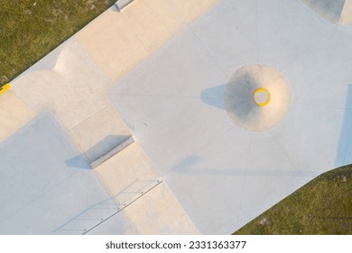 Aerial top view of a public playground for a skateboard in a recreation park. - Powered by Shutterstock