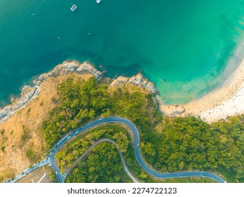 aerial top view The road around Phuket beach on the high mountain winds along the beach and various viewpoints.The road is steep and sharp.good view on the road. relax in beautiful nature.