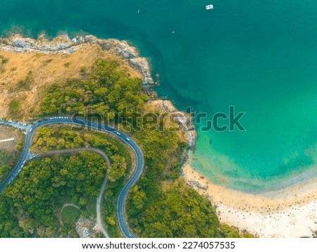 aerial top view The road around Phuket beach on the high mountain winds along the beach and various viewpoints.The road is steep and sharp.good view on the road. relax in beautiful nature.