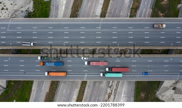Aerial top view road traffic\
interchange in city, Aerial view of highway and overpass in city,\
Expressway top view, Road traffic an important\
infrastructure.