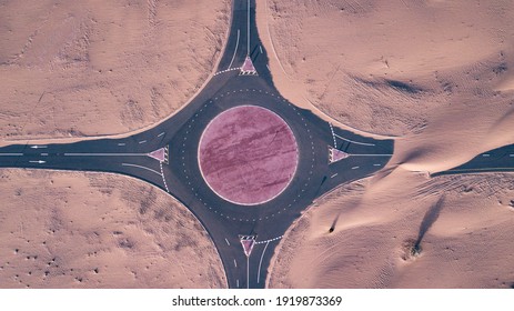 An Aerial Top View Of Roads Through Sand Dunes In Dubai, UAE