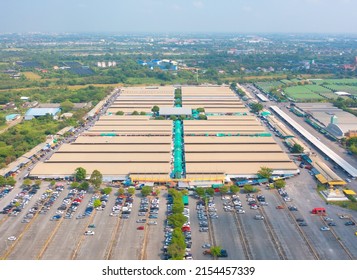 Aerial Top View Of Sanam Luang Street Market , Green Roof Tops, Horse Shoe Shape Drive Thru And Parking Area. Tents With Retail Shops.