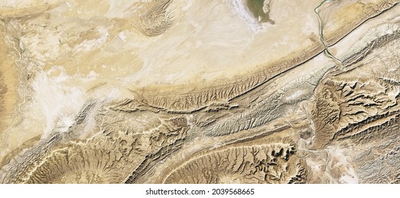 Aerial top view of sand terrain, desert land in satellite photo, topography, Earth surface map. Relief pattern background, landscape and topography theme. Elements of this image furnished by NASA