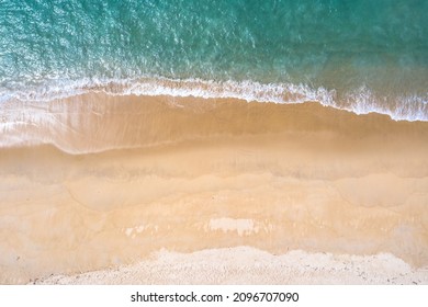 aerial top view sea waves seamless loop on the white sand beach. Wave after wave swept towards the shore. green sea, white bubble waves,and clear sand landscape. Paradise beach. - Shutterstock ID 2096707090