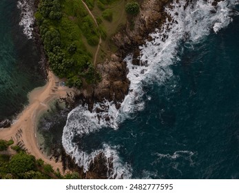 Aerial top view of sea waves hitting rocks on the beach with turquoise sea water. Amazing rock cliff seascape in the Sri Lankan coastline. Drone shot.
boats are parked in the shore - Powered by Shutterstock