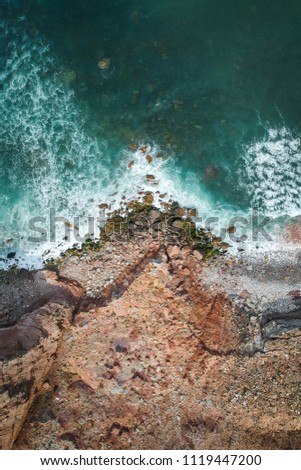 Similar – Aerial Drone View Of Dramatic Ocean Waves Crushing On Rocky Landscape