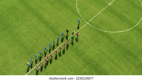 Aerial Top View Shot of Soccer Championship Match Beginning. Two Professional Football Teams Enter Stadium Field Where they Will Compete for the Champion Status. Start of the Major League Tournament - Powered by Shutterstock