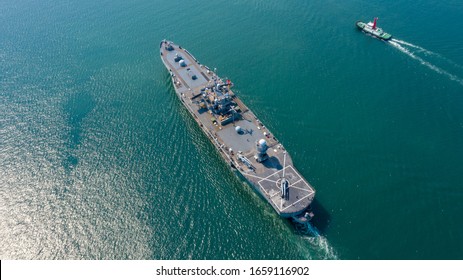 Aerial Top View Of Smart Hi-tech Naval Ship, Battle Ship, Warship, Military Ship Resilient And Armed With Weapon Systems, Though Armament On Troop Transports. Support Navy Ship.Military Sea Transport.