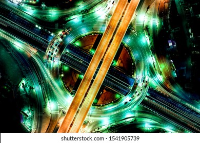 Aerial top view of smart modern transportation with Expressway, Road and Roundabout, multilevel junction traffic highway-Top view. Important infrastructure and transport.