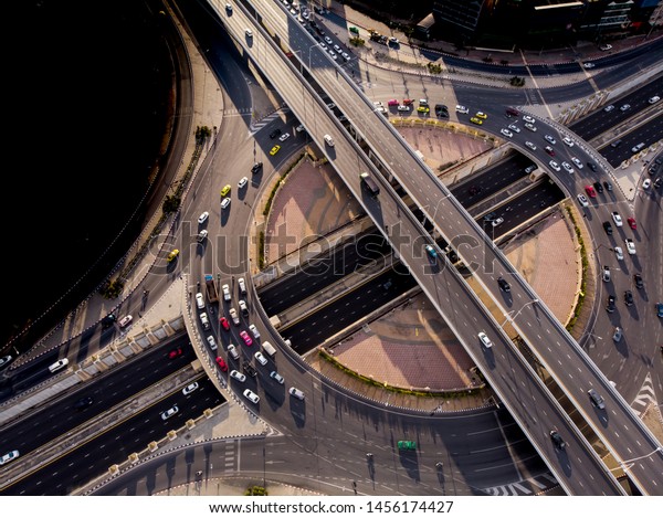 Aerial top view of Smart transportation\
with Expressway, Road and Roundabout, busy highway traffic night\
time. Important\
infrastructure.