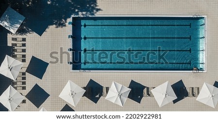 Aerial top view of a swimming pool in a hotel