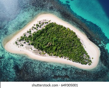 Aerial top view of tropical island surrounded by turquoise sea. Palawan May 2017