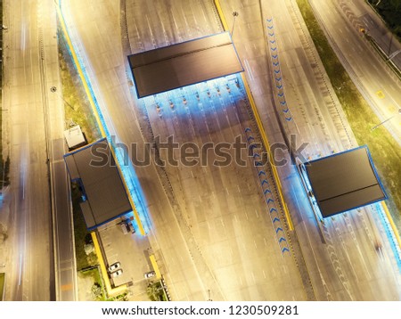 Aerial top view turnpike at expressway or highway road at night for transportation, distribution or traffic background.