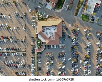Aerial top view of typical small town shopping center with big parking for car. Rancho Penasquitos, San Diego, California, USA.