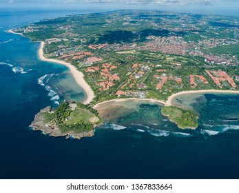 Aerial top view of upmarket Nusa Dua beach with hotels and turquoise water in Bali, Indonesia