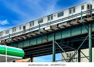 The aerial tramway running on the rails of The Bronx, which is a borough of New York City (USA), under a clear blue sky. - Powered by Shutterstock