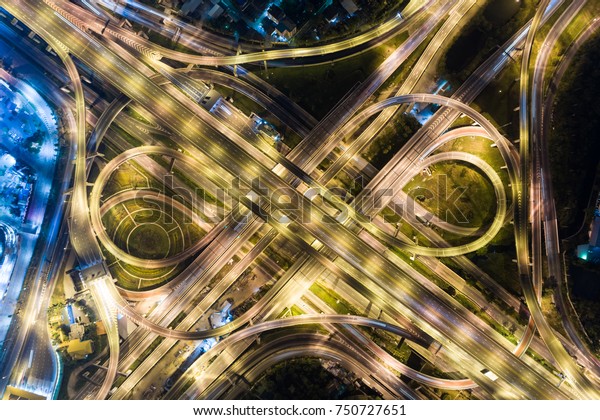 Aerial transport traffic bird\
eye view light intersection in the city, Top view of transport\
concept