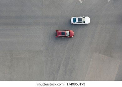 Aerial View Of 2 Cars Driving On Asphalt Road Top View