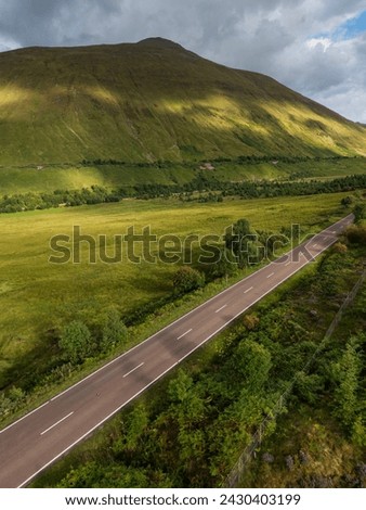 Aerial view of the A82 road as it passes through Bridge of Orchy with the mountains. Highlands Scotland Stock photo © 
