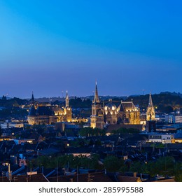 aerial view of Aachen city at night with cathedral and town hall, germany
