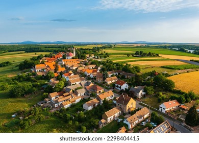 Aerial view about Palkonya which is a one-street village located at the northeastern end of the Villany Mountains, Winecountry. Famous about mostly small and medium-sized family wineries. - Shutterstock ID 2298404415