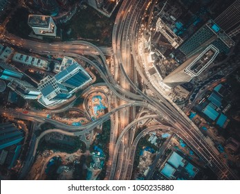 Aerial View Above Of Busy Highway Intersection Road Junctions At Morning. The Image Contain Soft Focus, Grain And Noise.