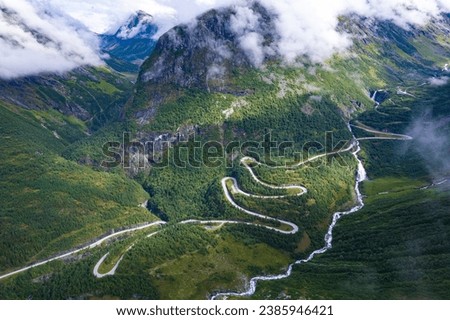 Aerial view from above the clouds  the valley of Videseter decending towards fjord in Norway