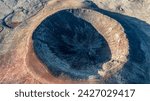 Aerial view from above of the crater Calderon Hondo. Calderon Hondo is a volcanic caldera in the sland of Fuerteventura, Canary Islands.