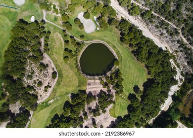 Aerial View From Above Golf Course With Lush Green Fields And Lake During A Sunny Summer Day, No People. Nature Background, Recreation Outdoor Concept. Costa Blanca. Spain