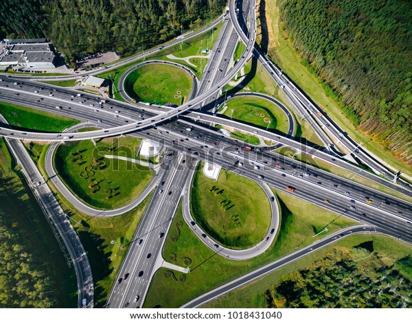 Aerial view above of a massive\
highway road intersection in Moscow city, Russia. Drone\
photography