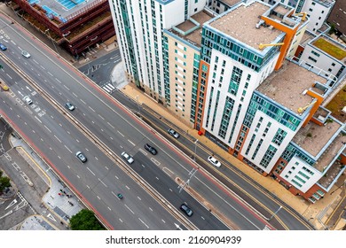 Aerial View From Above Onto Busy City Streets With Vibrant And Colourful Apartment Blocks And Copy Space