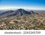 Aerial view above Paradise Valley, Arizona looking SW at Camelback Mountain on a cool December morning 2022