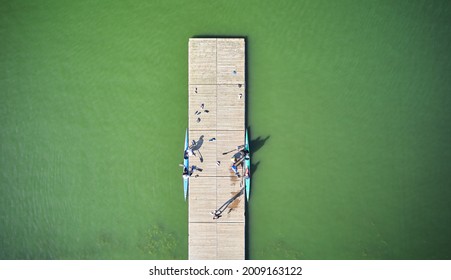 Aerial View Above The Pier With Two Rowing Boats On The Water