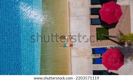 Similar – #A0# Lunch break with laptop by the pool