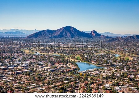 Aerial view from above Scottsdale looking SW towards Camelback Mountain and downtown Phoenix, Arizona