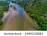 Aerial view of adventure team doing Kayaks on the cold waters of the Nestos River in Toxotes, Xanthi, Greece. Nestos river is one of the most popular among rafters in Greece