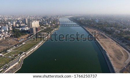 Aerial view of Ahmedabad,Gujarat/India. Riverfront and garden with skyline buildings drone view landscape. Post coronavirus covid-19 city reopens. social distancing rules after city restrictions ease.