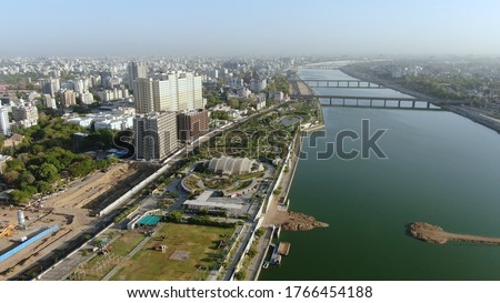 Aerial view of Ahmedabad,Gujarat,India. Riverfront and garden with skyline buildings drone view landscape. Post coronavirus covid-19 city reopens. social distancing rules after city restrictions ease.