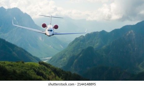 Aerial view of aircraft. Airplane is flying over mountains with forest. Business travel. Commercial plane - Powered by Shutterstock