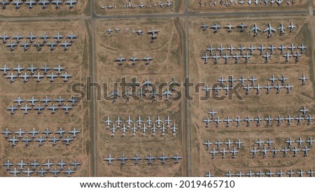 Aerial view of aircraft boneyard or graveyard is storage area for airplanes that are retired from service they are generally located in deserts for example in Tucson USA 4k screenshot of animation