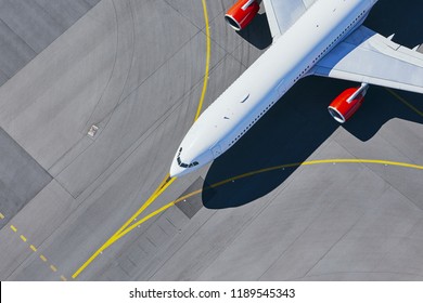 Aerial view of airport. Airplane taxiing to runway before take off. - Shutterstock ID 1189545343