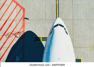 Aerial View Of The Airport. Airplane Taxiing To Terminal. 