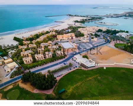 Aerial view of Al Hamra golf course and famous residential area Al Hamra village in Ras al Khaimah, United Arab Emirates