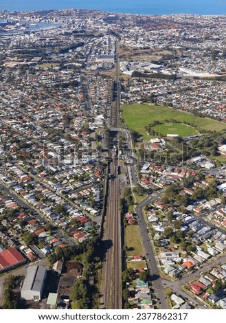Aerial view along the main rail line into Newcastle NSW Australia. Shown suburbs of Waratah and Islington.