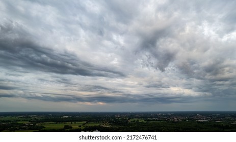 Aerial View Amazing Sunset Over Of The Suburbs With The City Under Dramatic Rain Cloud. Global Warming Effect Black Thunderstorm Dramatic Rain Clouds, Dramatic Sky, Shot By A Drone. High Quality Photo